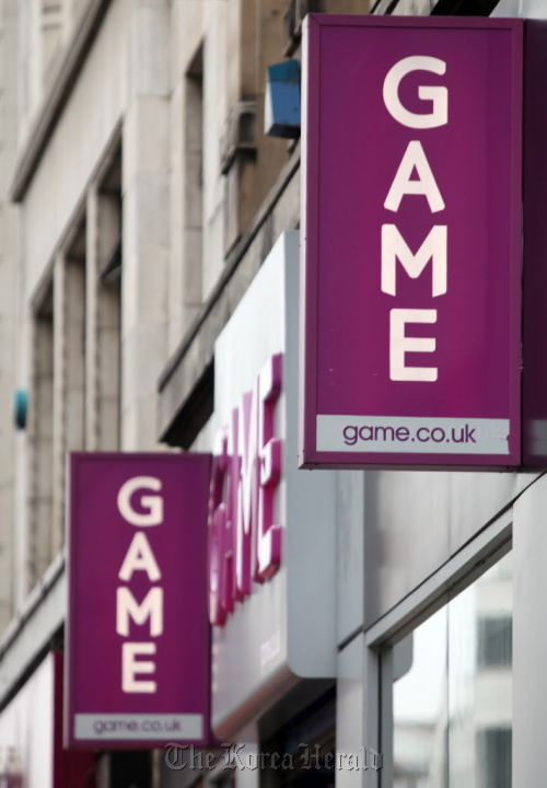 A sign hangs outside a branch of Game Group Plc, on Oxford Street in London. (Bloomberg)