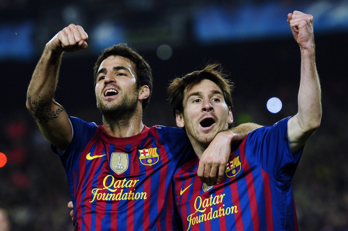 Barcelona’s Lionel Messi (right) celebrates his goal with teammate Cesc Fabregas. (AP-Yonhap News)