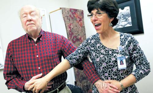 Dr. Ellen Markus (right), speech language pathologist with UNC Voice Center, teaches speaking techniques to Ray Carpenter, 85, of Chapel Hill during a vocal therapy, March 12. (Raleigh News & Observer/MCT)