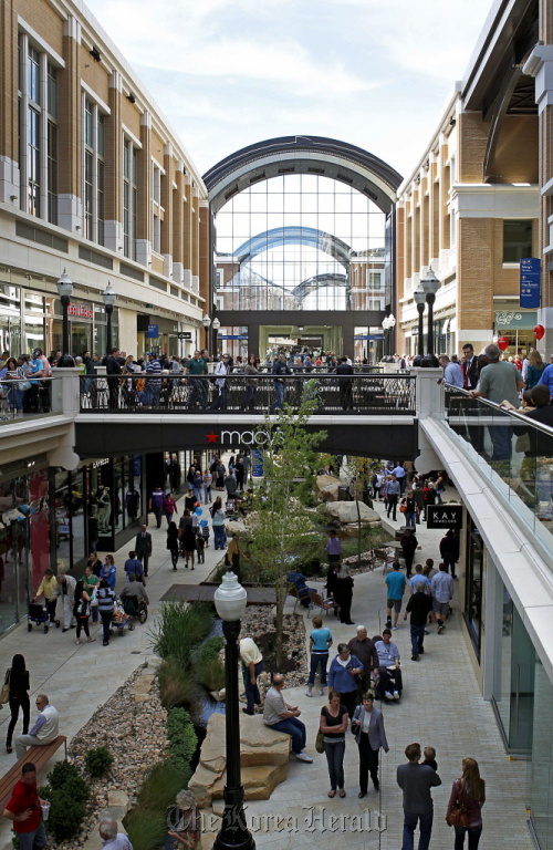 Shoppers walk around the newly opened City Creek Center in Salt Lake City, Utah.(Bloomberg)