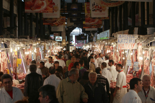 People browse the main meat market in central Athens on Monday. (AP-Yonhap News)