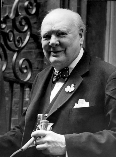 In this June 24, 1952, file photo, Sir Winston Churchill smiles at the front door of 10 Downing Street, London. (AP)