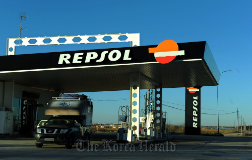 A driver exits a Repsol YPF SA gas station in Tembleque, Spain. (Bloomberg)