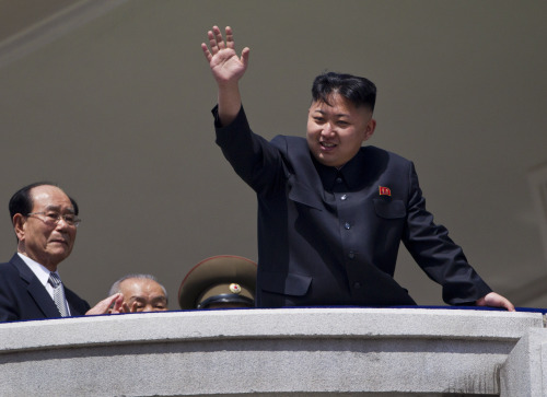 North Korean leader Kim Jong-un waves from a balcony at the end of a mass military parade in Pyongyang’s Kim Il-sung Square to celebrate 100 years since the birth of his grandfather and North Korean founder Kim Il-sung on Sunday. (AP-Yonhap News)