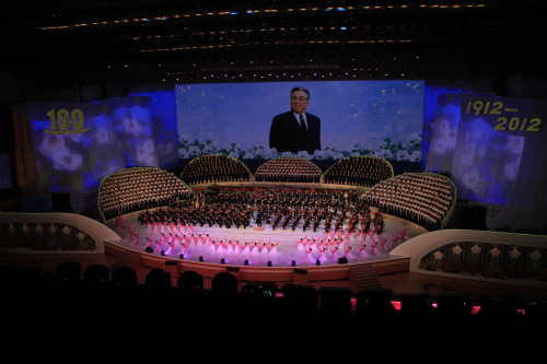An image of late North Korean president Kim Il Sung is displayed during a special performance by singers and musicians at the Pyongyang indoor gymnasium in Pyongyang, Monday, April 16, 2012. (AP)