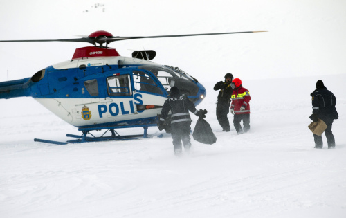 Police, military and members of the Swedish accident investigation authority, continue their search of the crash site area Sunday, March 18 2012, to investigate the fate of a Norwegian Hercules airplane. (AP)