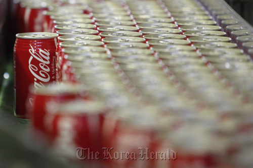 Coca-Cola cans move along the production line of Sendai Coca-Cola Products Co.’s Zao plant in Zao town, Miyagi prefecture, Japan. (Bloomberg)