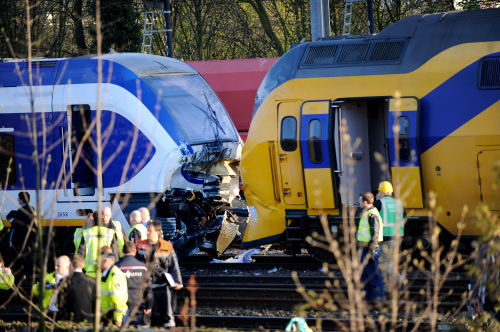 Police and other rescuers search for victims at the accident site of a train collision in west Amsterdam on Saturday. (Xinhua-Yonhap News)