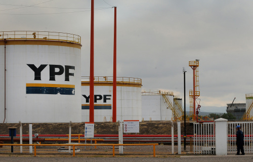 An employee stands at the YPF SA refinery in Lujan de Cuyo, Argentina. (Bloomberg)