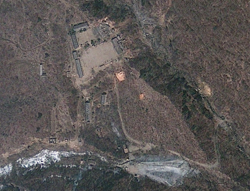 This April 18, 2012 satellite image provided by GeoEye appears to show a train of mining carts, at the lower center of the frame, and other preparations under way at North Korea’s Punggye-ri nuclear test site, but no indication of when a detonation might take place, according to analysis by the U.S.-Korea Institute at Johns Hopkins School of Advanced International Studies. (AP-Yonhap News)