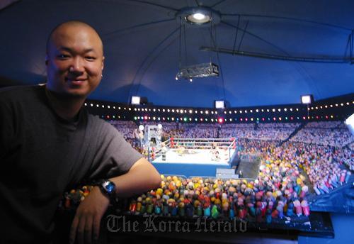 Kim Tak-hoon with his claymation work in the background. (Mark Ratto)