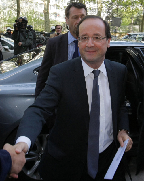 President-elect Francois Hollande is greeted as he arrives at the Socialist Party headquarters in Paris Monday May 7, 2012.(AP)