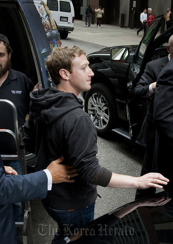 Mark Zuckerberg, founder and chief executive officer of Facebook Inc., leaves the Sheraton hotel in New York. (Bloomberg)