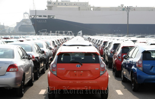 Toyota Motor Corp. automobiles sit parked ahead of shipping at the port of Sendai, Miyagi Prefecture, Japan. (Bloomberg)