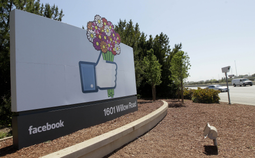 This May 11, 2012, photo shows a sign is shown at the Facebook campus in Menlo Park, Calif. Half of Americans think Facebook is a passing fad, according to the results of an Associated Press-CNBC poll. (AP)