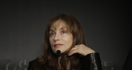 Actress Isabelle Huppert listens during a press conference for In Another Country at the 65th international film festival on Monday. (AP-Yonhap News)