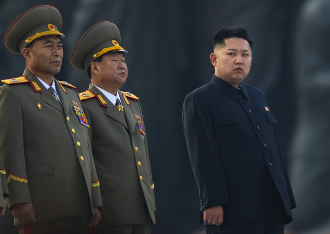 In this April 13 photo, North Korean leader Kim Jong-un stands next to senior military leaders during a ceremony in honor of his father Kim Jong-il and grandfather,Kim Il-sung in Pyongyang. (AP-Yonhap News)