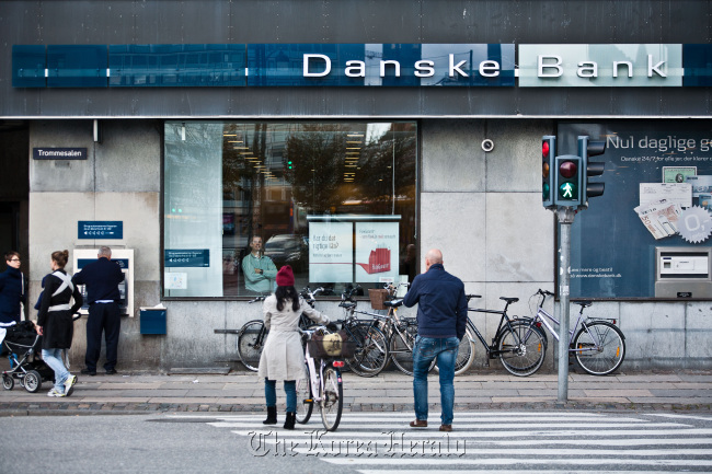 Pedestrians pass a Danske Bank branch in Copenhagen, Denmark. (Bloomberg)