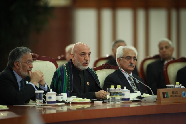 Afghan President Hamid Karzai (second from left) addresses the large group meeting of the 12th Meeting of the Council of Heads of Member States of the Shanghai Cooperation Organization at the Great Hall of the People in Beijing on June 7. (Xinhua-Yonhap News)