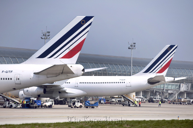 Air France aircraft, part of the Air France-KLM Group, are seen on the tarmac at Roissy Charles de Gaulle airport in Paris. (Bloomberg)