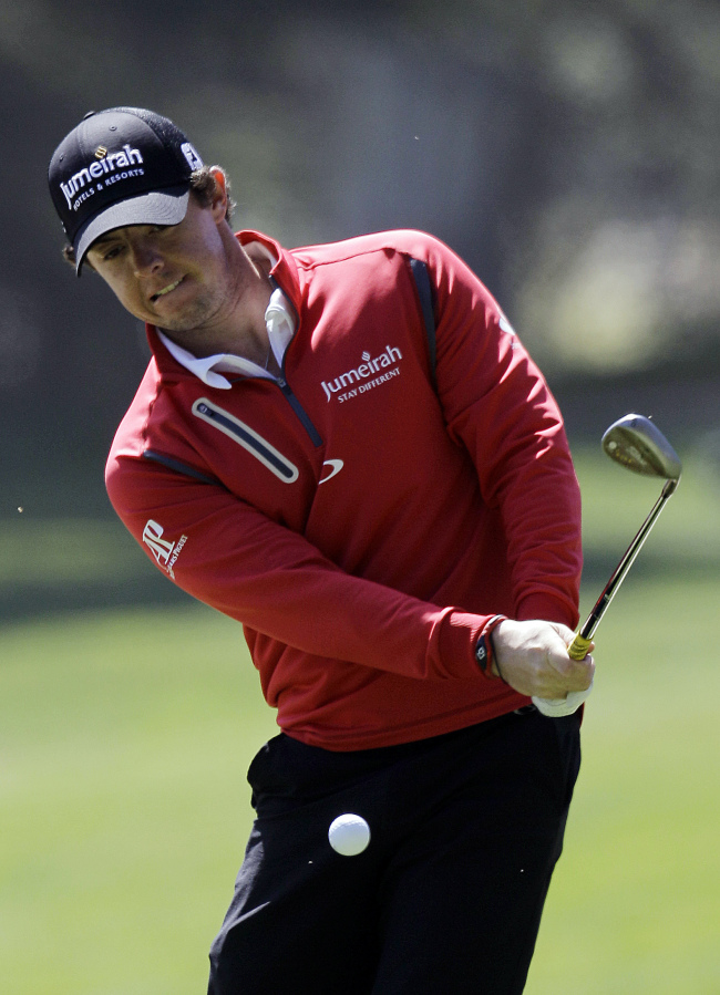 Rory McIlroy chips onto the 12th green during a practice round ahead of the U.S. Open on Tuesday. AP-Yonhap News