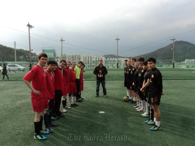 Teams line up to play in a previous futsal tournament in Yeosu.