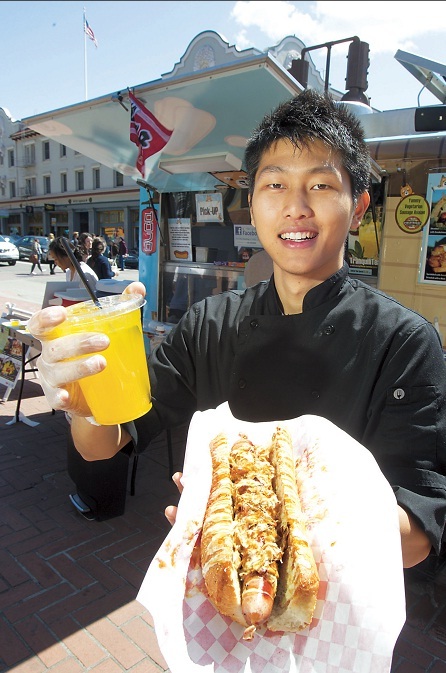 Michael Koh, a 19-year-old University of California student, serves up his signature Dojo Dogs in Berkeley, California, on April. (MCT)