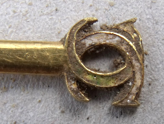 This recent undated photo provided Tuesday by the Seine et Marne region council shows part of a pin recently discovered at Fontainebleau castle, south of Paris. (AP-Yonhap News)