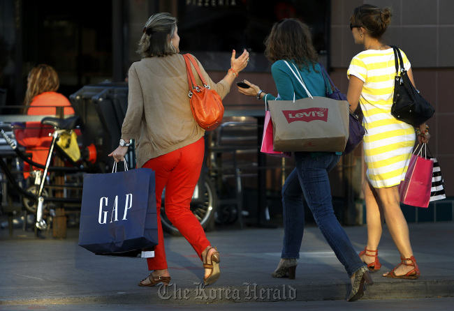 Pedestrians carry shopping bags at the Third Street Promenade in Santa Monica, California. (Bloomberg)