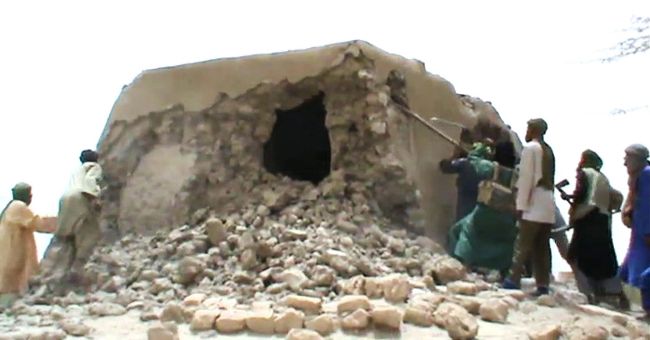 A still from a video shows Islamist militants destroying an ancient shrine in Timbuktu on Sunday. (AFP-Yonhap News)