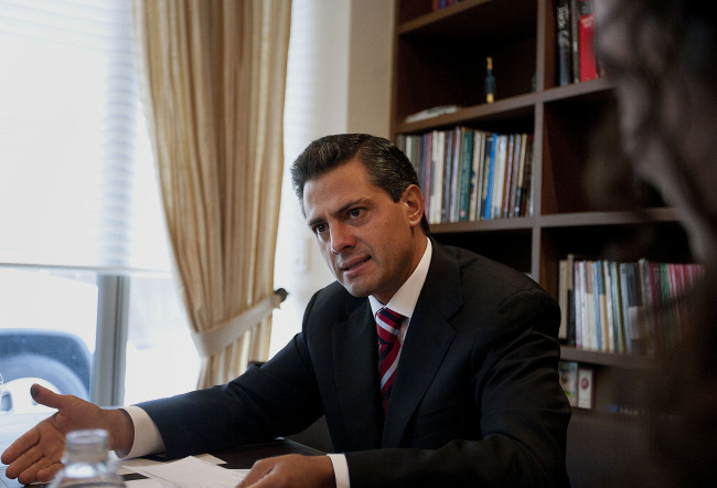 Enrique Pena Nieto, who preliminary data show won the Mexican presidency yesterday, speaks to members of the international media in Mexico City on Monday. (Bloomberg)