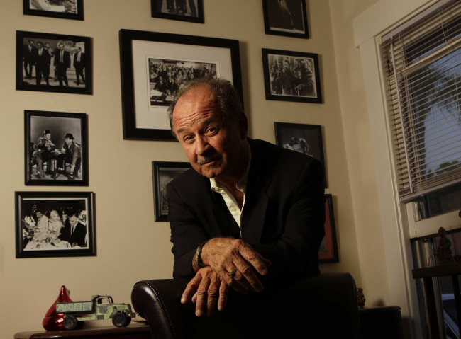 Don Baisa poses for a portrait with some of his Hollywood photographs and memorabilia at his home in Altadena, California, June 14, 2012. (LA Times/MCTeye)