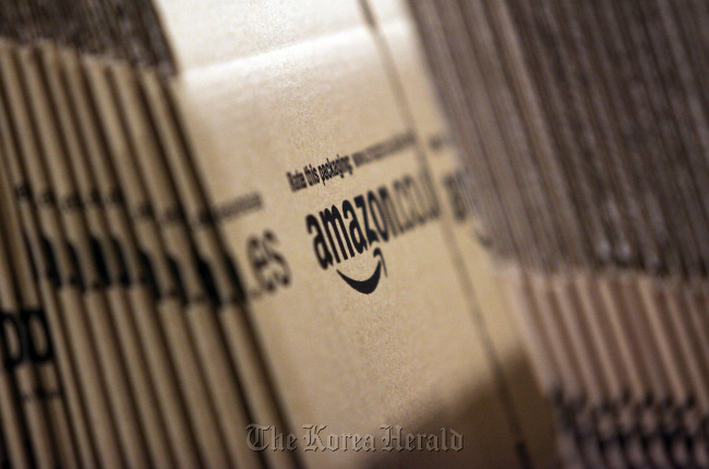 Amazon.co. branded cardboard boxes sit stacked in Ridgmont, U.K. (Bloomberg)