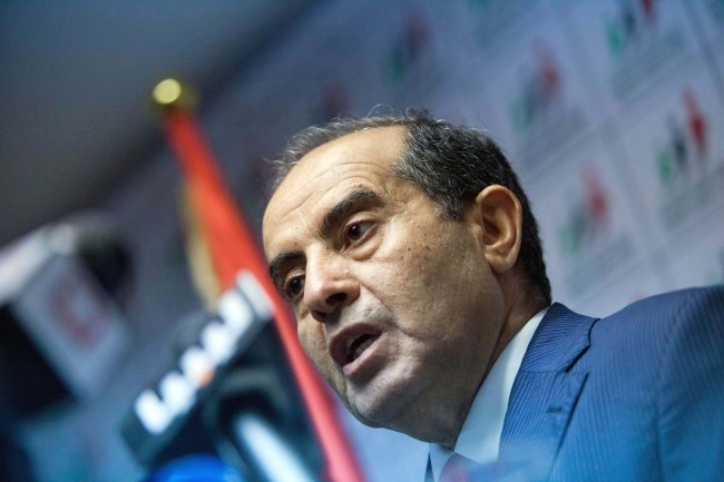 Mahmoud Jibril speaks to the media during a presser at the National Forces Allies headquarters in Tripoli on Sunday. (AP-Yonhap News)