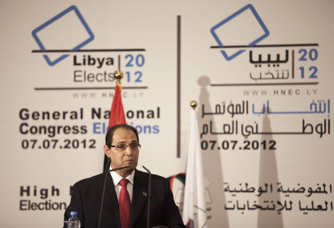 A member of the High National Elections Commission, Nouri al-Abbar talks during the announcement of the election results in Tripoli on Tuesday. (AP-Yonhap News)