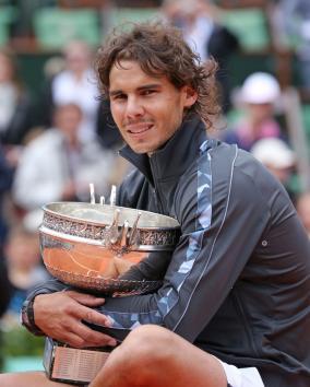 Rafael Nadal, shown in June with the trophy for winning a record seventh French Open men's singles title, in Thursday withdrew from the Summer Olympics tennis competition. Nadal won the men's singles gold medal in 2008(UPI)