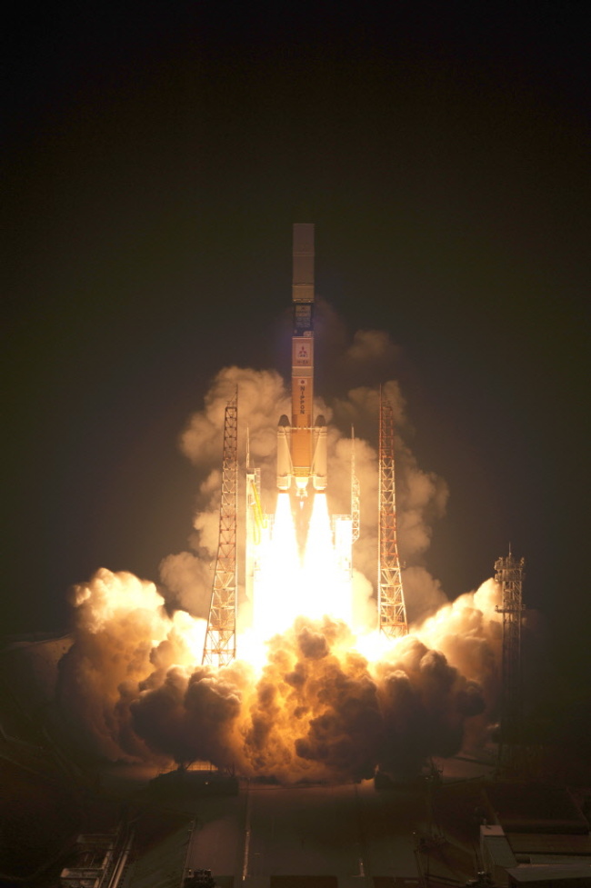 A handout photograph shows a Mitsubishi Heavy Industries Ltd. H-2A rocket which carries Arirang-3 taking off from Japan Aerospace Exploration Agency's (JAXA) Tanegashima Space Center in Tanegashima, Kagoshima Prefecture, Japan on Friday, May 18, 2012. (Bloomberg photos and graphics)