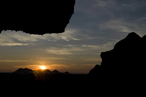 The sun rises over Gebel Dakrur in Siwa, Egypt, on Wednesday, Jan. 16, 2008. Located in the Libyan Desert Egypt's Siwa Oasis is home to one of the Middle East's most ancient settlements. Photographer: Dana Smillie/Bloomberg News