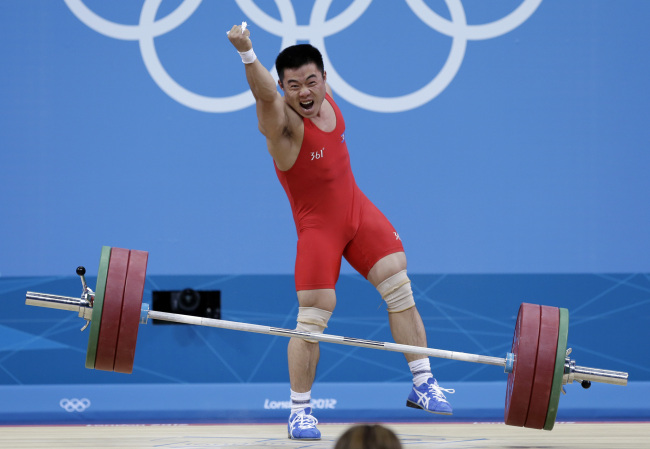 Kim Un-Guk sets a new world record in the men's -62kg weightlifting class on Monday. (London Olympic Joint Press Corps)