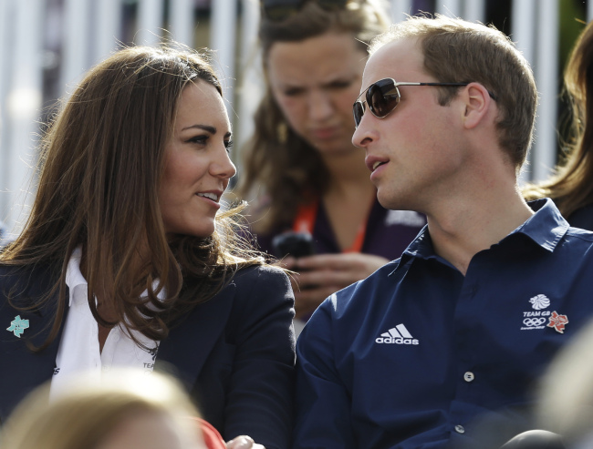 Britain’s Catherine, Duchess of Cambridge, and Britain’s Prince William, the Duke of Cambridge watch the equestrian eventing cross country phase at the 2012 Summer Olympics on Monday in London. (AP-Yonhap News)