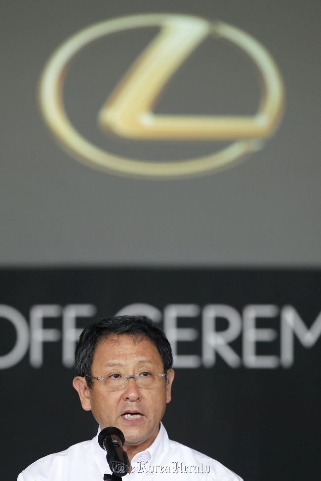 Akio Toyoda, president of Toyota Motor Corp., speaks during a line-off ceremony for the company’s Lexus ES series sedans on July 6. (Bloomberg)