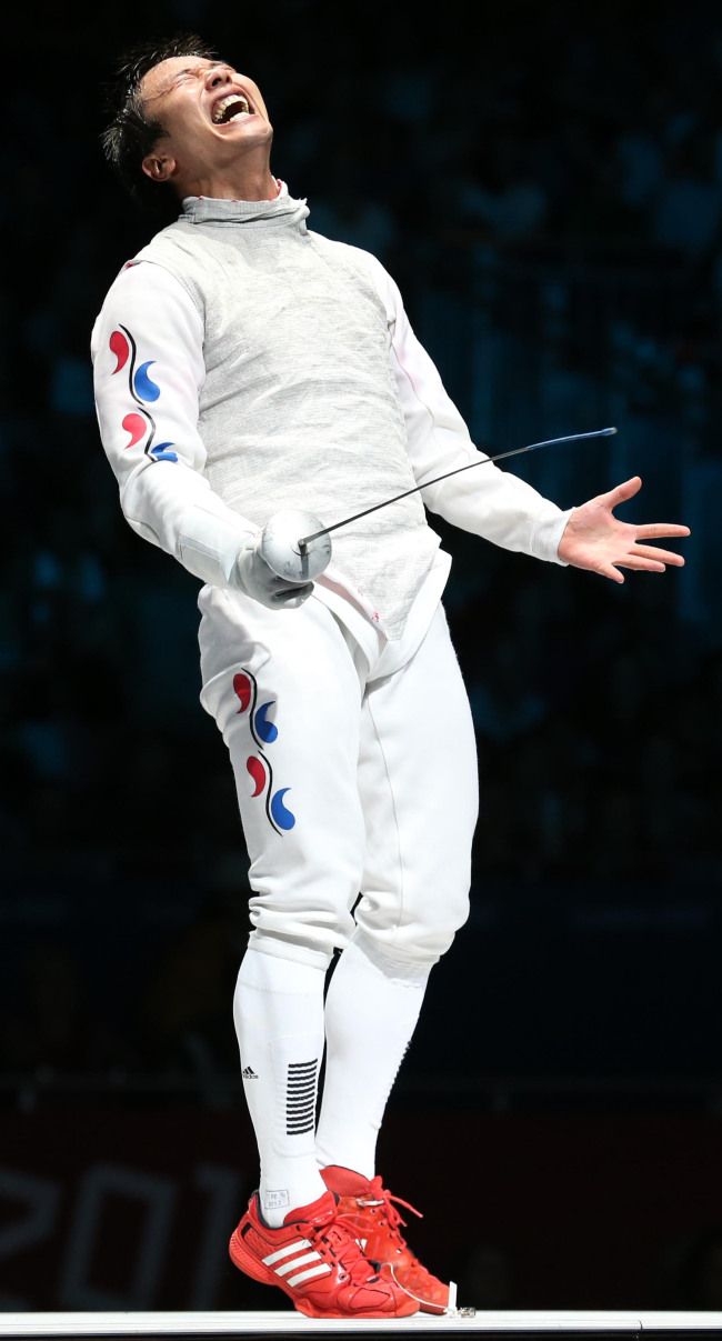 Korea’s Choi Byung-chul celebrates his bronze-medal victory. ( London Olympic Joint Press Corps)