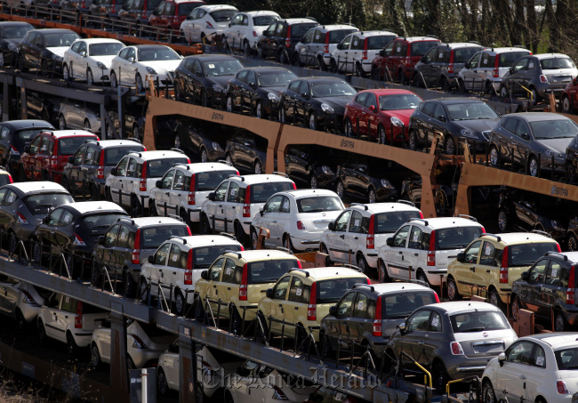 Fiat automobiles sit on rail freight wagons at the Fiat SpA factory in Cassino, Italy. ( Bloomberg)