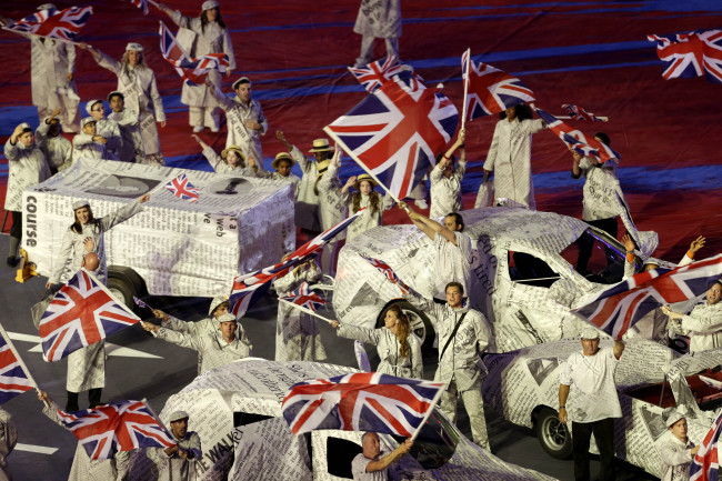 Performers wave the British Flag during the Closing Ceremony at the 2012 London Olympics, Sunday. (AP-Yonhap News)