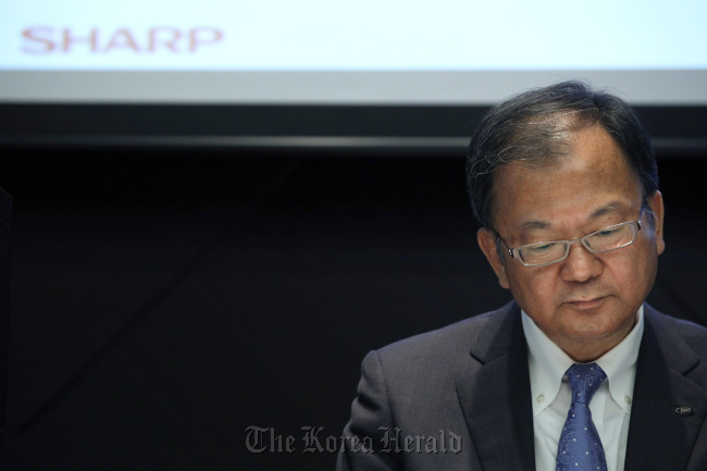 Takashi Okuda, president of Sharp Corp., pauses during a news conference in Tokyo. (Bloomberg)