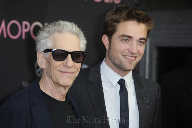 Director David Cronenberg (left) and actor Robert Pattinson attend the “Cosmopolis” Germany premiere at Cinema International, in Berlin, Germany on May 31. (MCT)