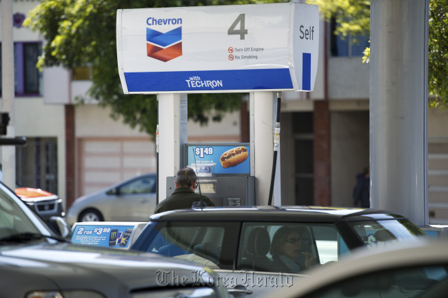 A customer buys fuel at a Chevron Corp. gasoline station in San Francisco, California. (Bloomberg)