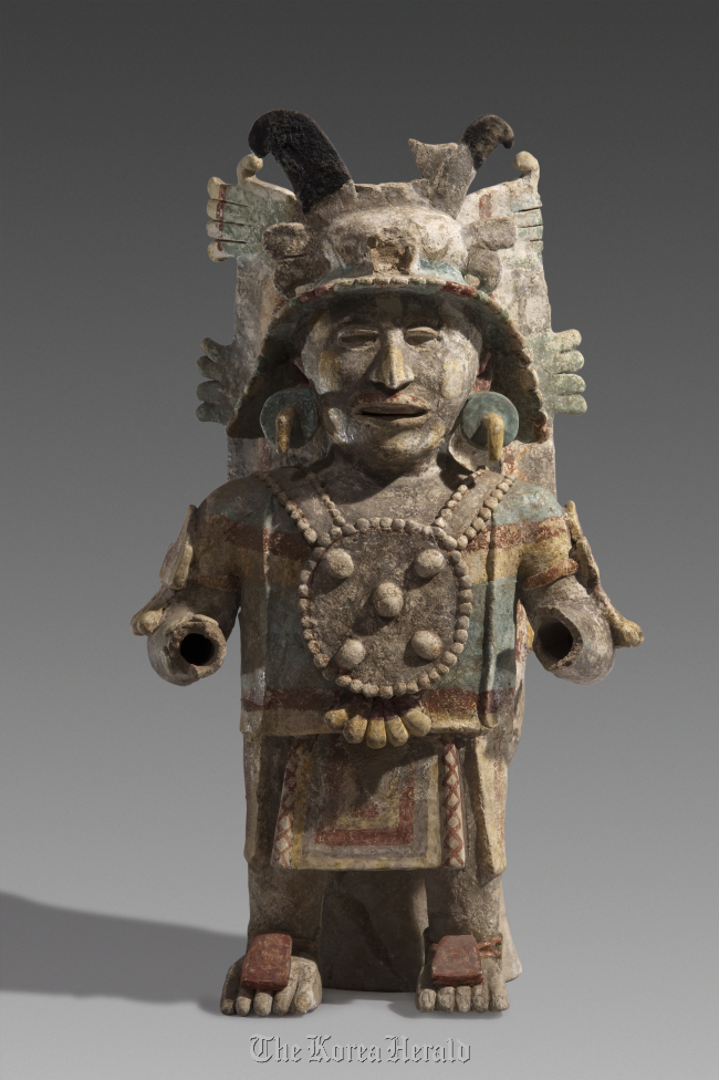 An 11th-15th century earthenware statue symbolizing the god of the sun found in Mexico. (The National Museum of Korea)