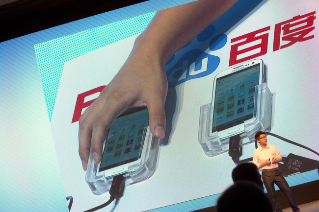 Smartphones are used to demonstrate Baidu Inc.’s new Internet browser at the company’s annual forum in Beijing on Monday. (Bloomberg)