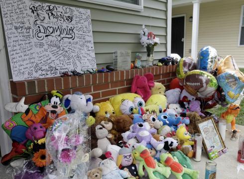 A makeshift memorial for the slain Dominick Andujar sets on his front porch in Camden, New Jersey. (AP)